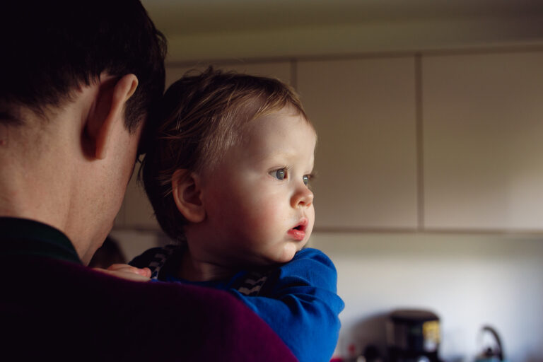 Dad and toddler having a quiet moment during a family photo session