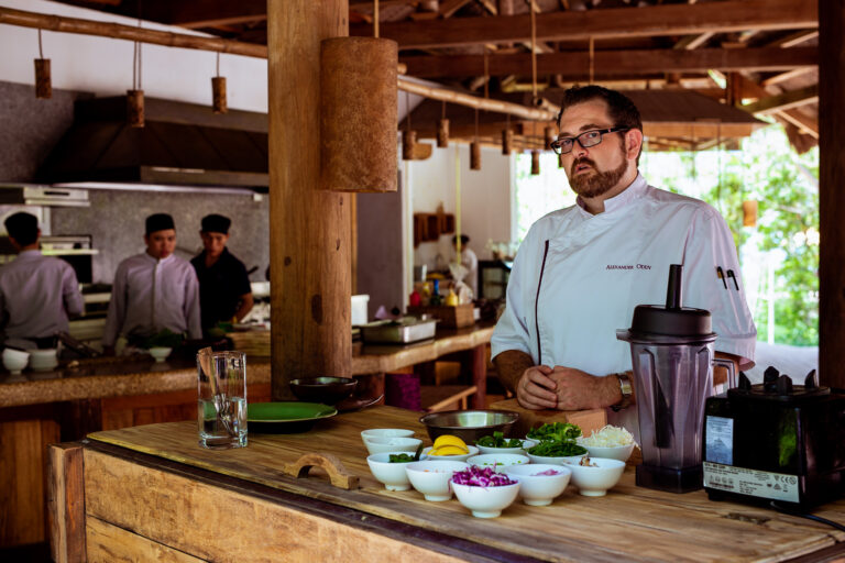 Chef Alexander Oddy poses for a portrait in the Six Sense Ninh Van Bay outdoor kitchen