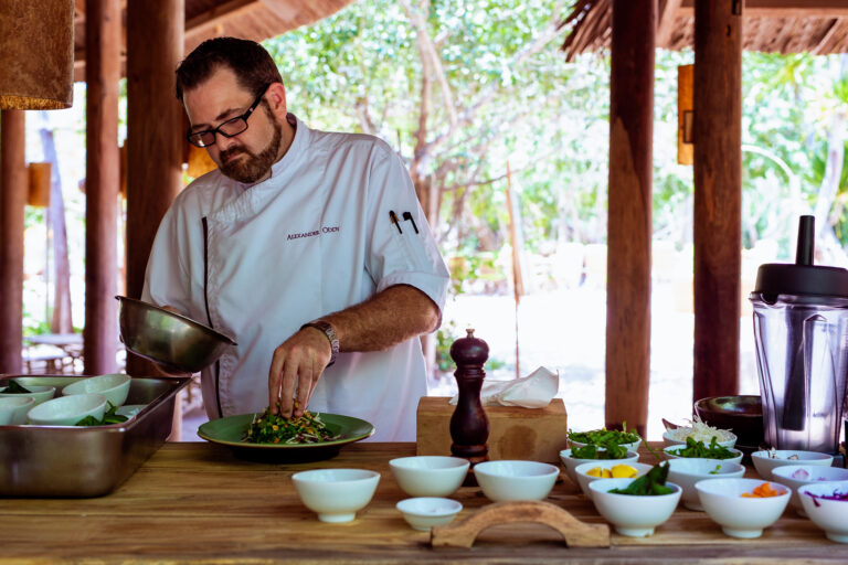 Chef Alexander Oddy preparing a salad at Six Senses Vietnam for feature in Word Magazine