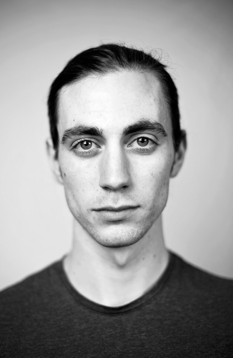 Indoor headshot at Rozewin Photography studio of a young man on a simple background