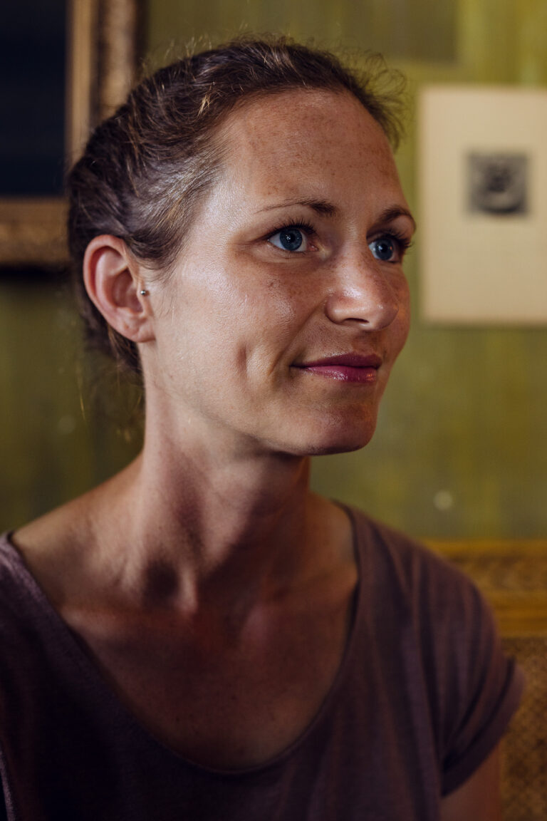 A young female long-distance runner poses for a portrait in a cafe in Ho Chi Minh