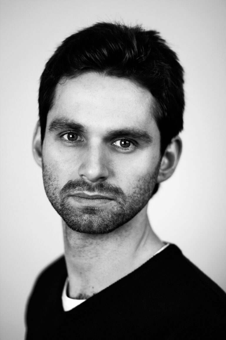 Indoor headshot at Rozewin Photography studio of a young male actor on simple plain background