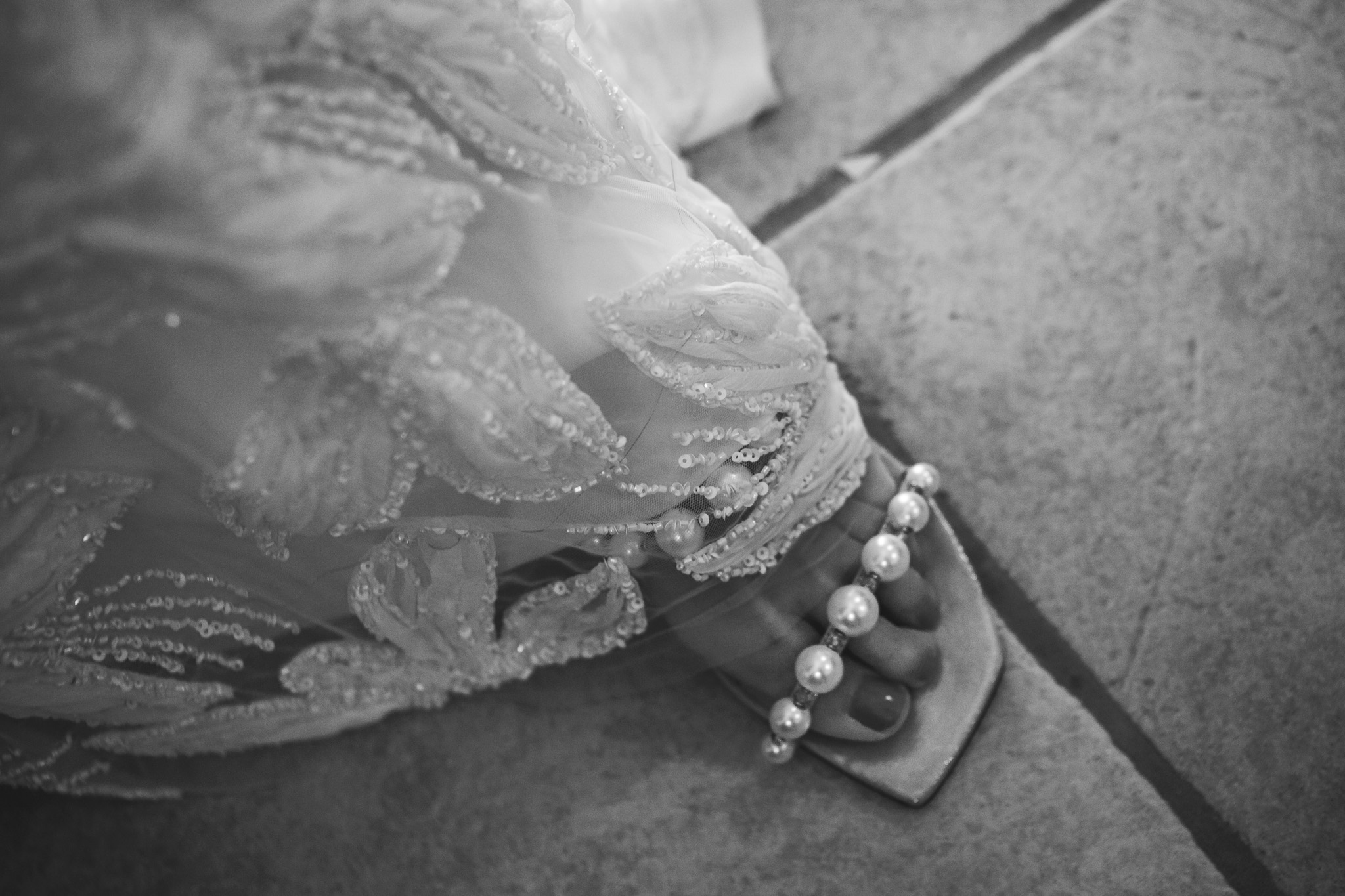 Bride shows off her Jimmy Choo wedding shoes.