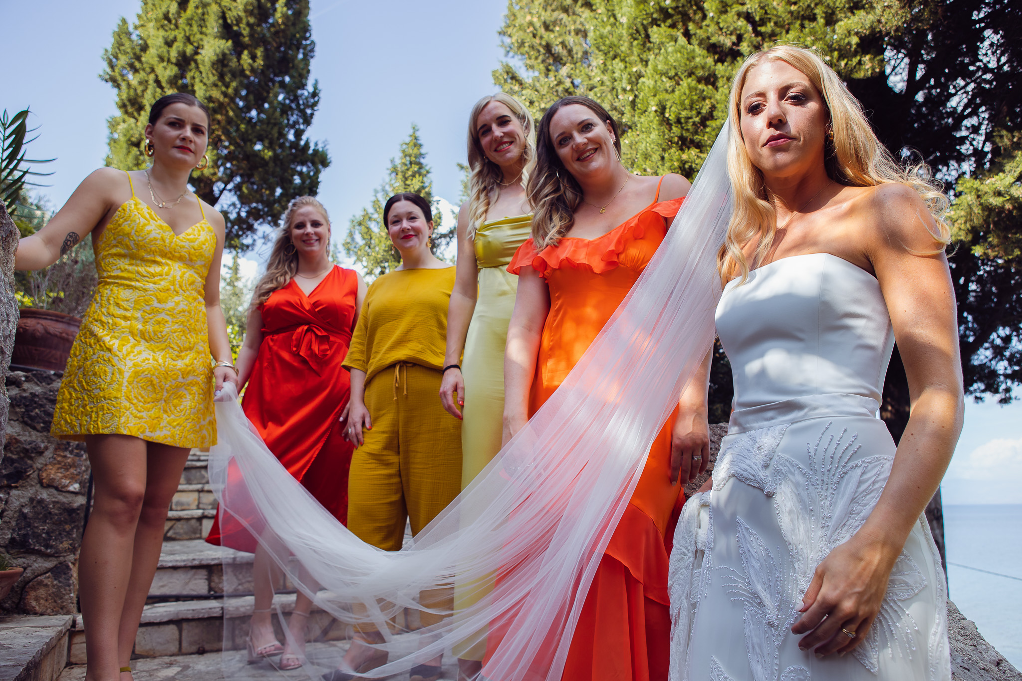 Alice and her bridesmaids pose for a portrait at their Crete villa before they head to the wedding.