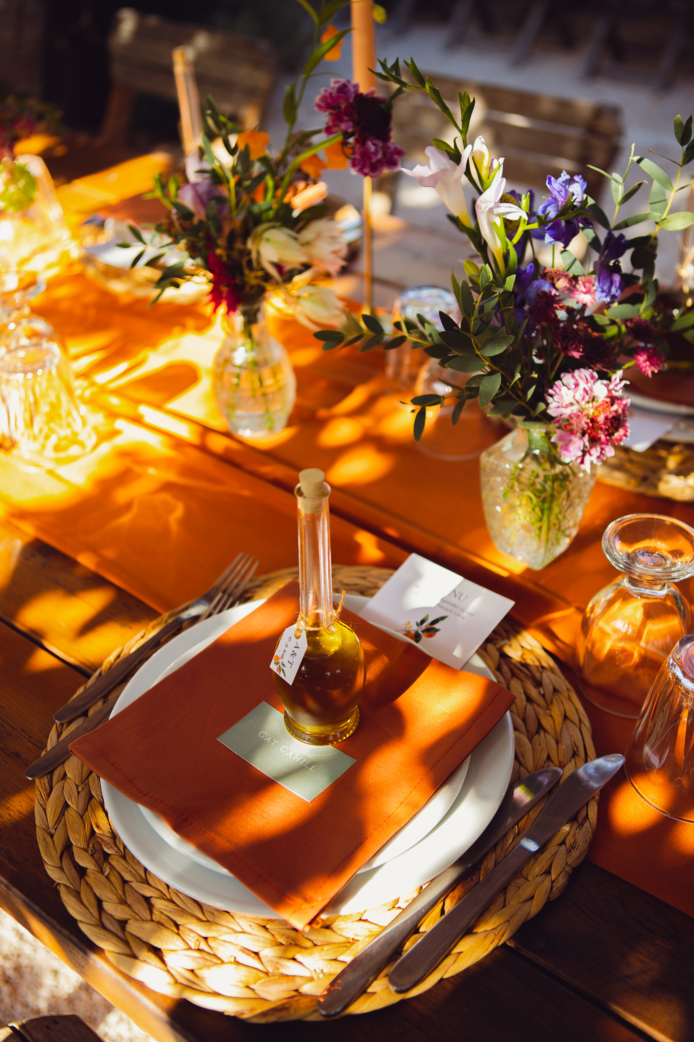 A beautiful wedding dinner place setting on a bright summer afternoon at Ambelonas Vineyard, Crete.