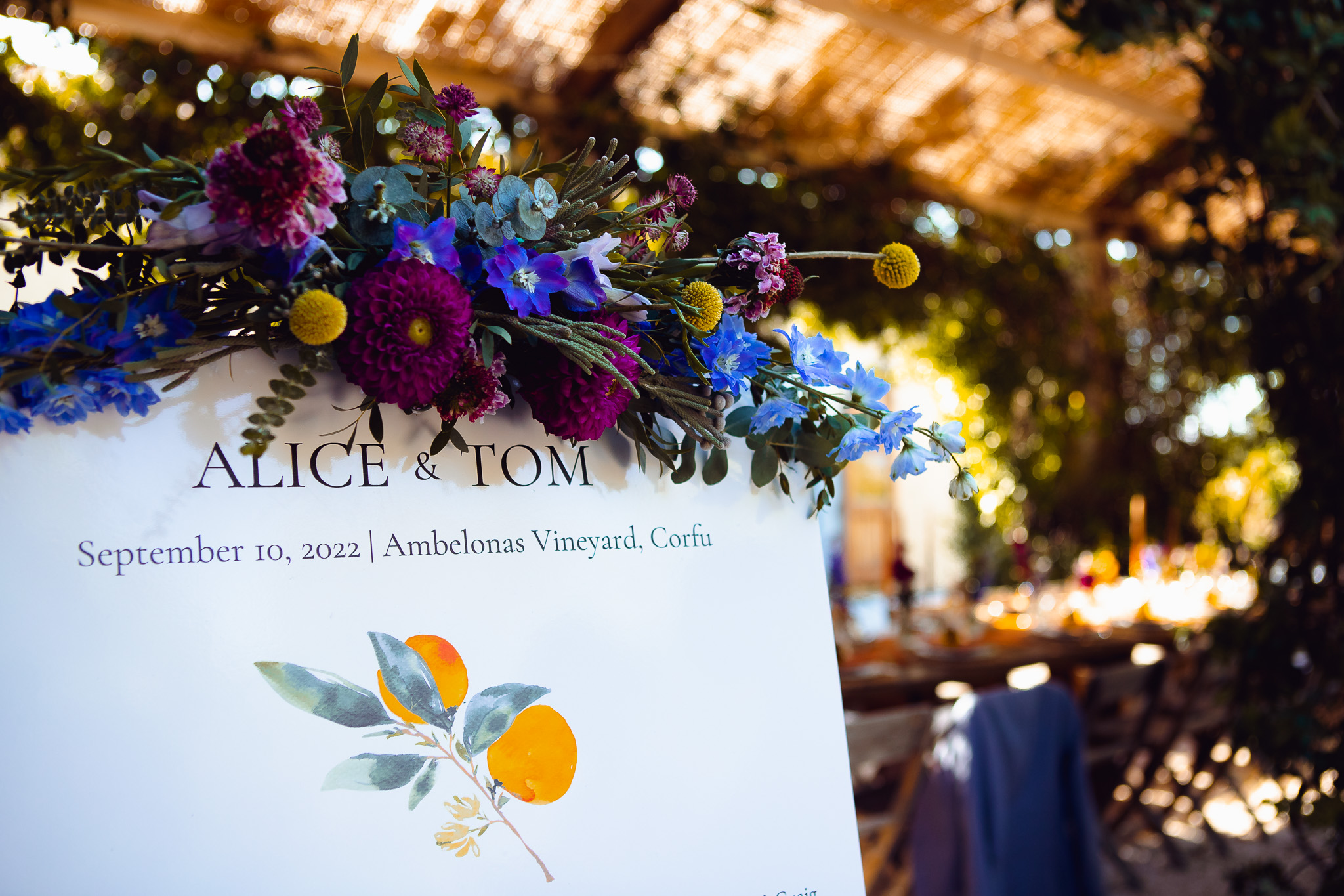 Wedding sign for Alice & Tom's wedding at Ambelonas Vineyard, Corfu, covered in flowers