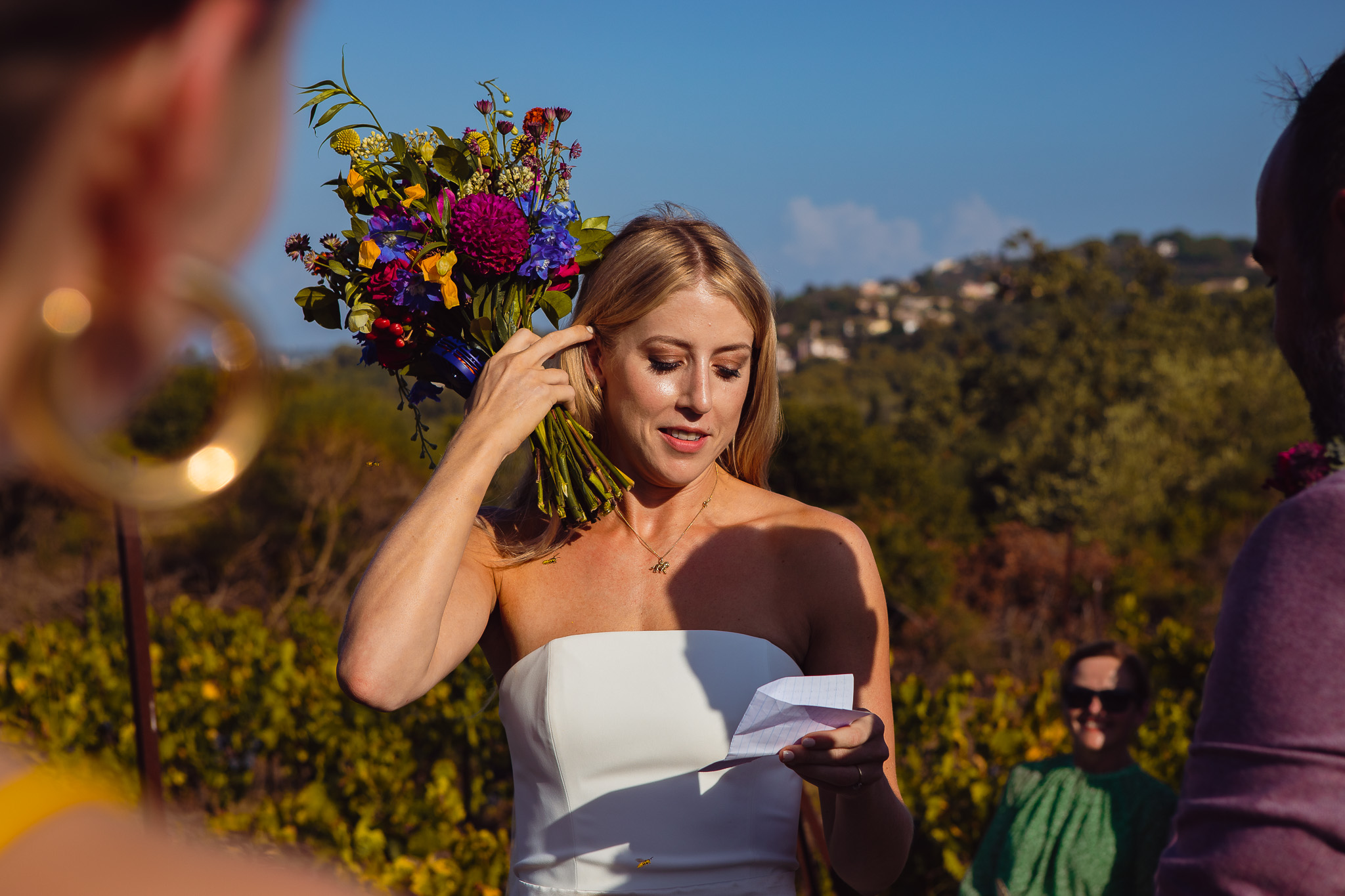 The bride reads her vows during a wedding ceremony at Ambelonas Vineyard, Corfu