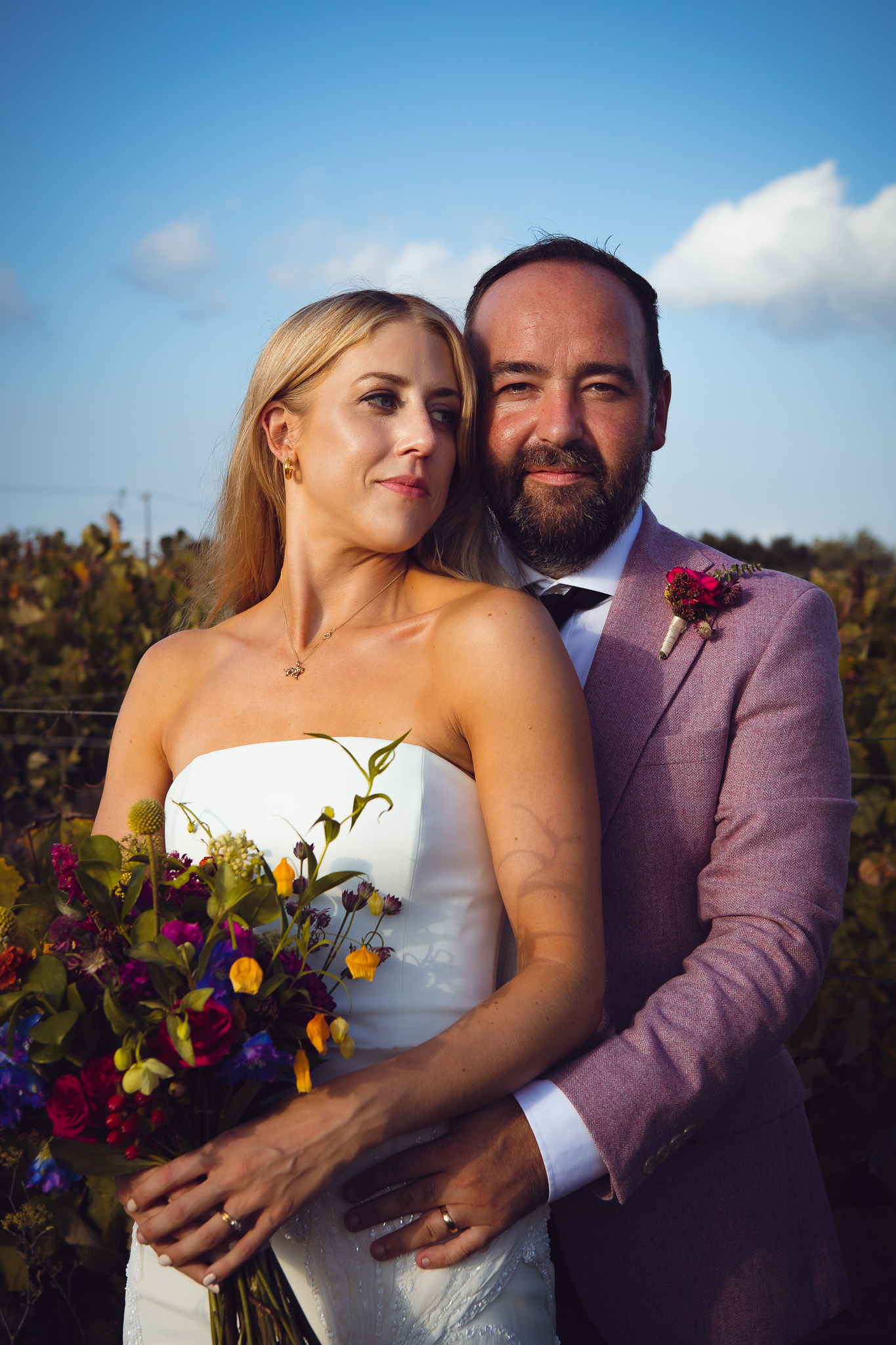 Alice and Tom pose in the vineyard during their couples photo session at Ambelonas Vineyard, Corfu