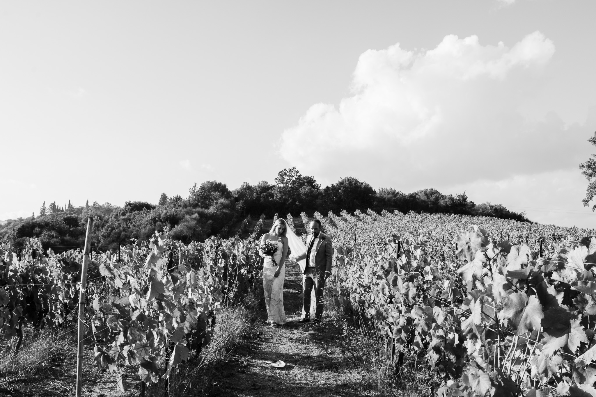 Alice and Tom walk through the vineyard at Ambelonas, Corfu during their couples photo session