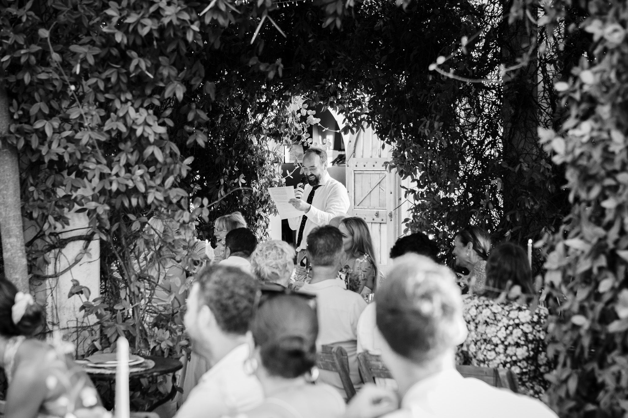 Groom laughs as he gives his wedding speech at his destination wedding in Ambelonas Vineyard, Corfu
