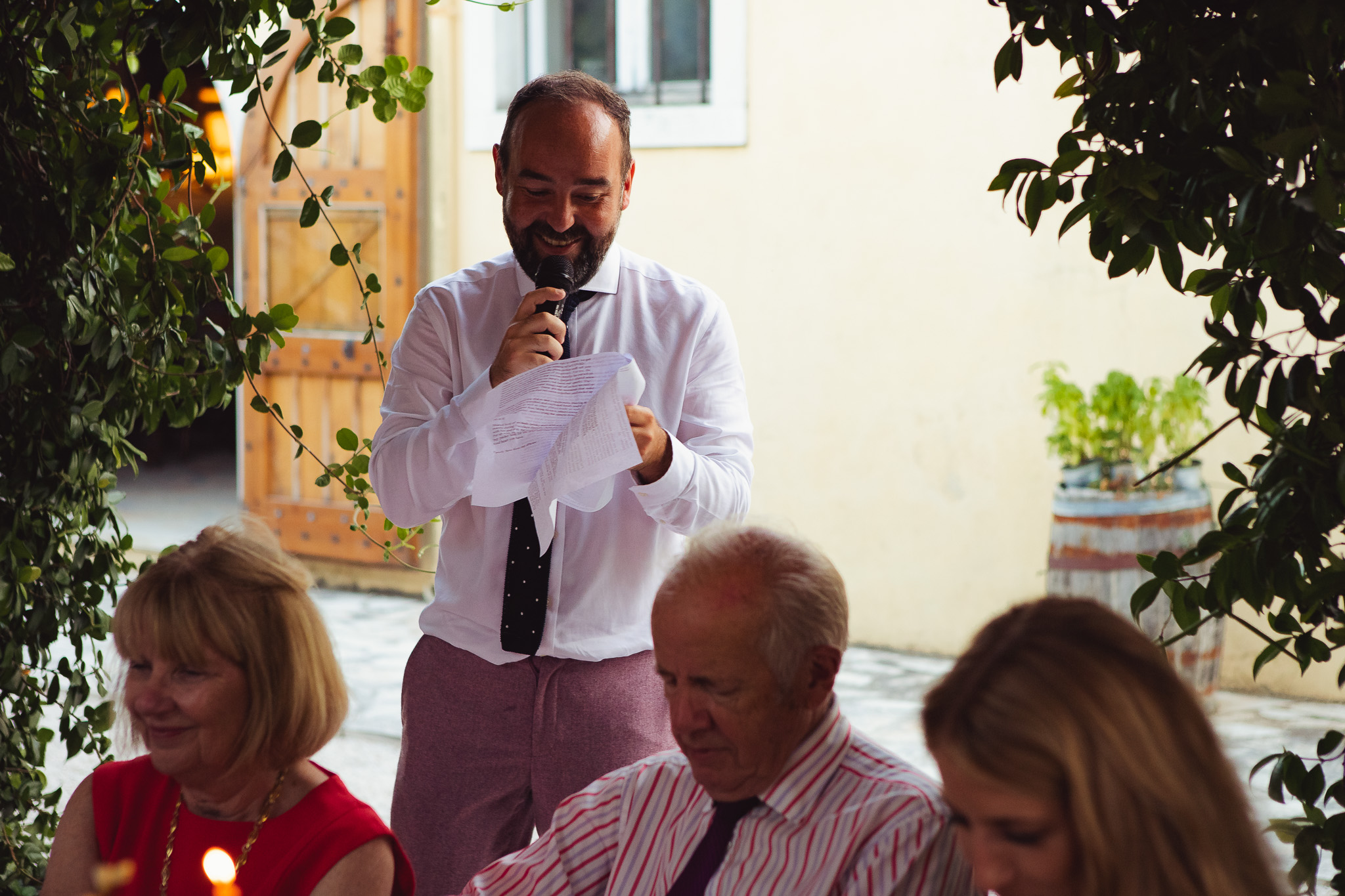Groom smiles as he gives his wedding speech at Ambelonas Vineyard, Corfu