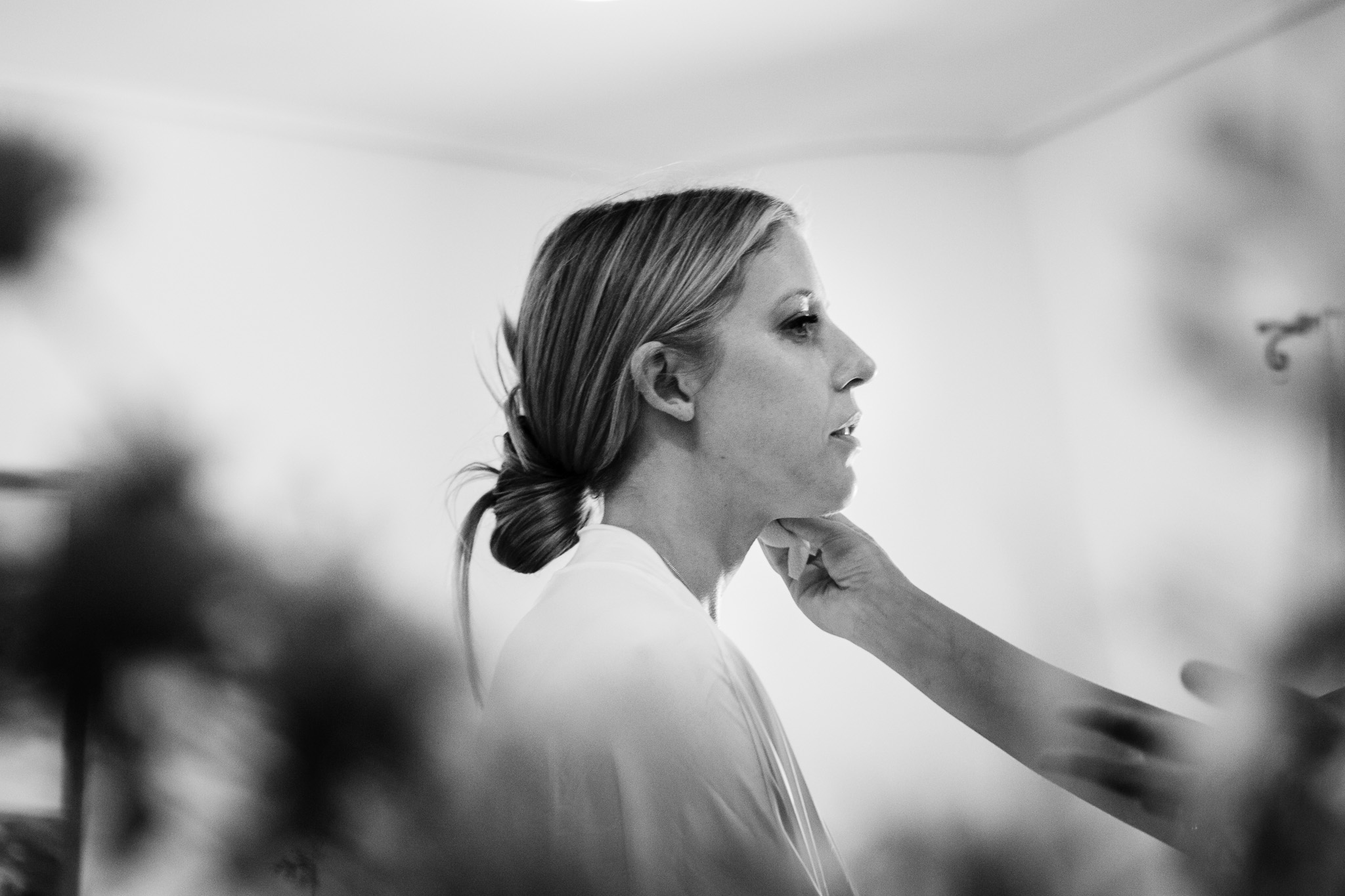 Alice having her makeup done in preparation for her wedding day.