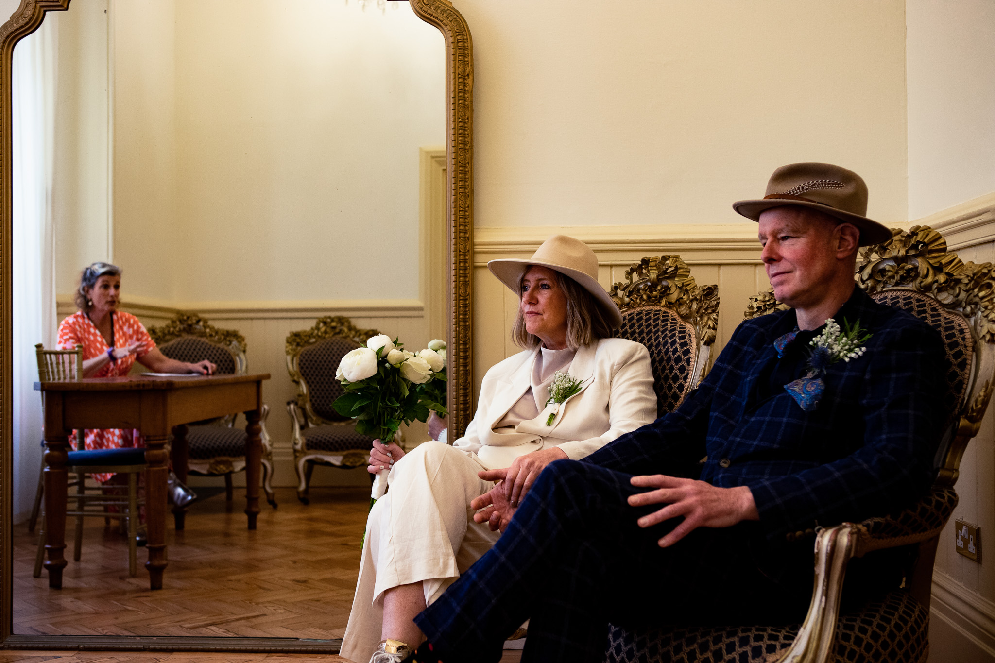 Mary and Mike talking to their wedding officiant at Brighton Town Hall.