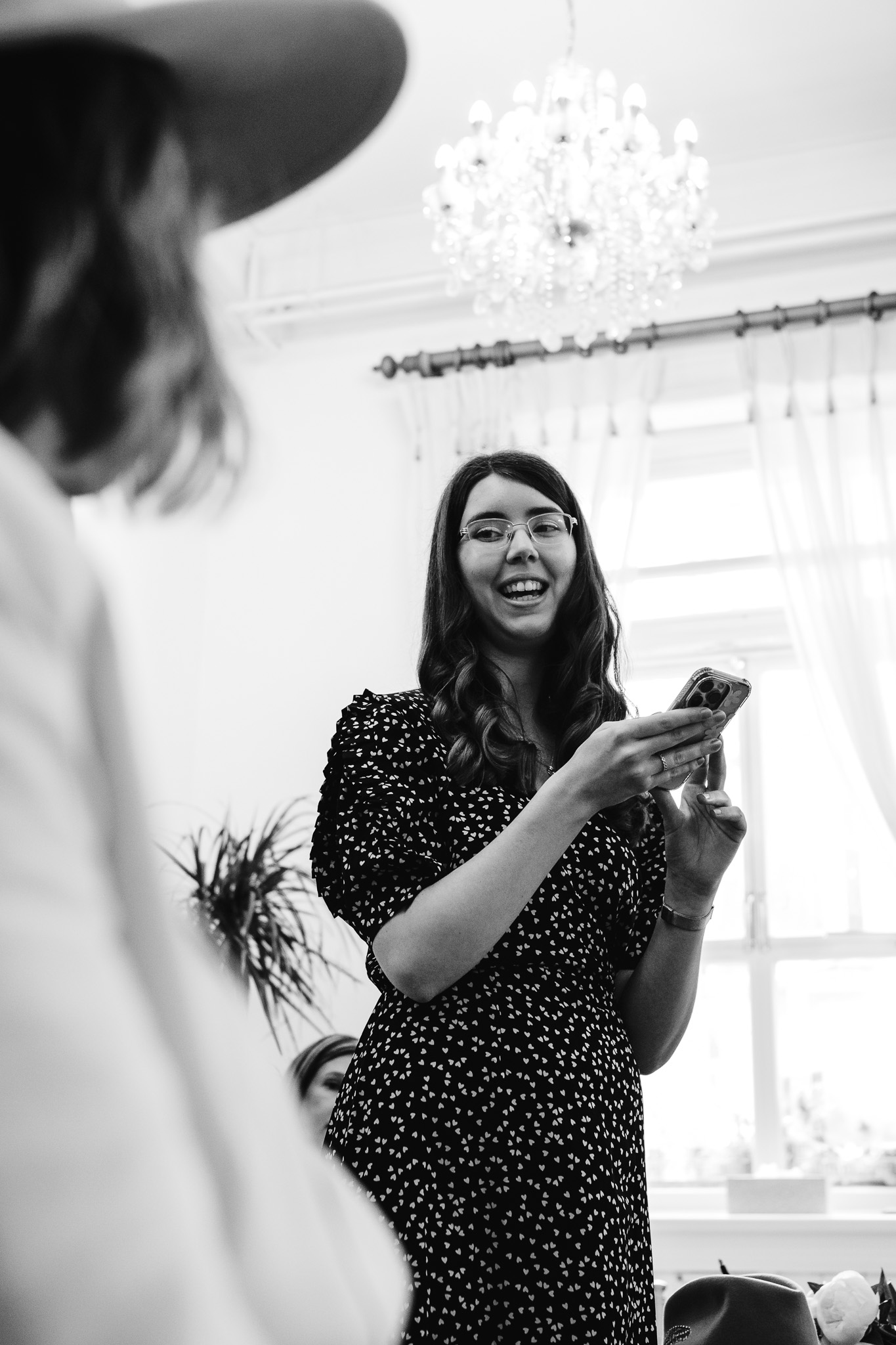 Girl smiling whilst giving a speech during a wedding ceremony at Brighton Town Hall.